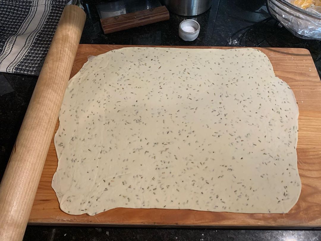 Rolling out crackers onto the board